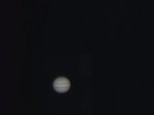 Jupiter with Ganymede passing in front and Io to the right. Taken 17/10/2011, Thorlabs  DCC 1645C USB camera at primary focus of Meade 8\" LXD55 SCT. 2,000 frames processed with Registax.