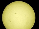 1st try of imaging the sun. Taken with my Canon 500D and a lens hood fitted with Baader solar film.