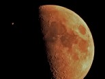 Occultation of Jupiter by an orange "Bushfire Moon", 18 Feb 2013